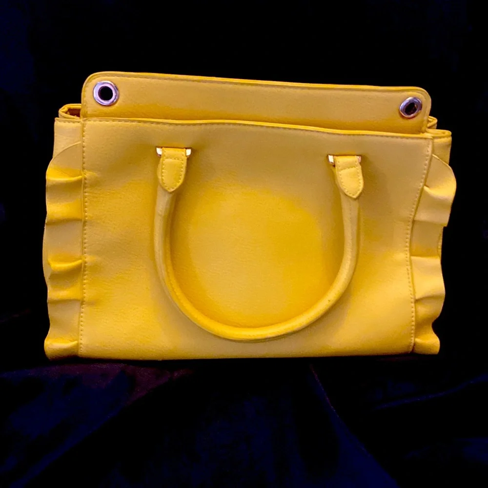 YELLOW EVA MENDES NEW YORK & COMPANY HANDBAG. It has 2 dividers with zippers.